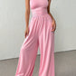 👗🌸 Elegant axelfri jumpsuit med vida ben