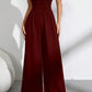 👗🌸 Elegant axelfri jumpsuit med vida ben