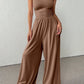 👗🌸 Elegant axelfri jumpsuit med vida ben