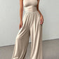 👗🌸 Elegant axelfri jumpsuit med vida ben