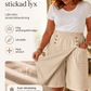 Asymmetriska wrap-shorts i knälängd för damer
