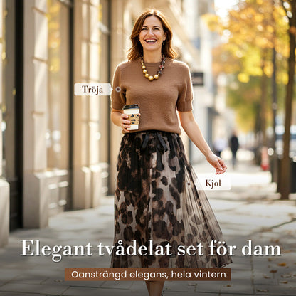 Tvådelat set för kvinnor med tröja och fladdrande leopardmönstrad kjol