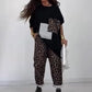 Löst sittande topp och byxor med leopardmönster