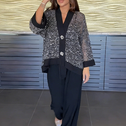 2-delat set med V-ringad paljettkofta och byxor med vida ben för dam