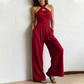 ✨ Korsad halterneck jumpsuit med elegant och luftig design