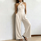 ✨ Korsad halterneck jumpsuit med elegant och luftig design