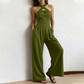 ✨ Korsad halterneck jumpsuit med elegant och luftig design