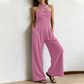 ✨ Korsad halterneck jumpsuit med elegant och luftig design