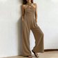 ✨ Korsad halterneck jumpsuit med elegant och luftig design