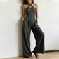 ✨ Korsad halterneck jumpsuit med elegant och luftig design