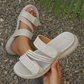 Dämpade platta sandaler med flera remmar