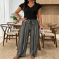 👗✨ V-ringad jumpsuit med vida ben och midjebälte