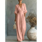 👗✨ Elegant V-ringad jumpsuit med vida ben