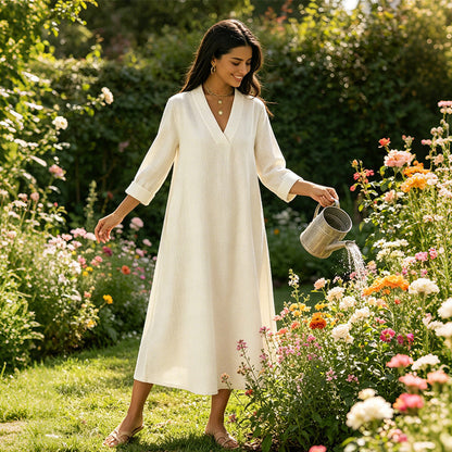 👗🌿 V-ringad A-linjeklänning i linne med fickor